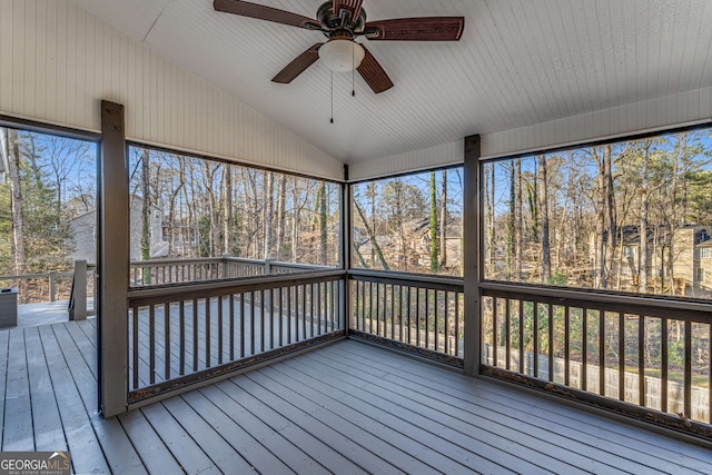 unfurnished sunroom featuring lofted ceiling and ceiling fan