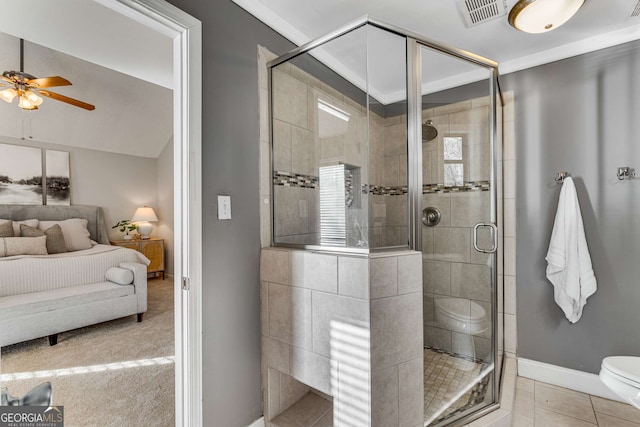 bathroom featuring tile patterned flooring, ceiling fan, crown molding, and toilet