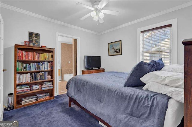 carpeted bedroom featuring crown molding, ensuite bathroom, and ceiling fan