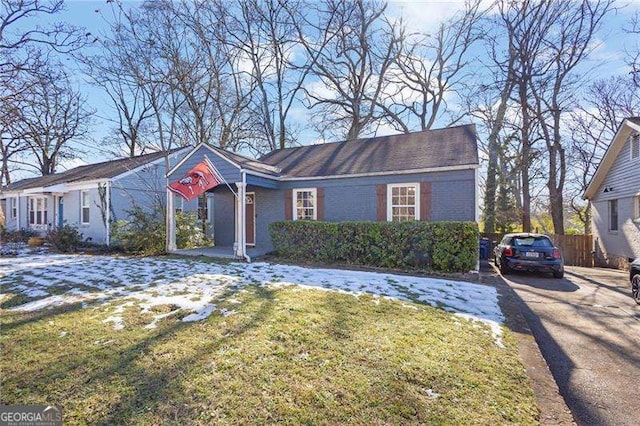 single story home featuring a front yard