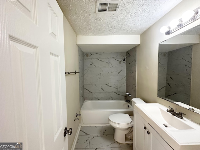 full bathroom with a textured ceiling, toilet, vanity, and tiled shower / bath