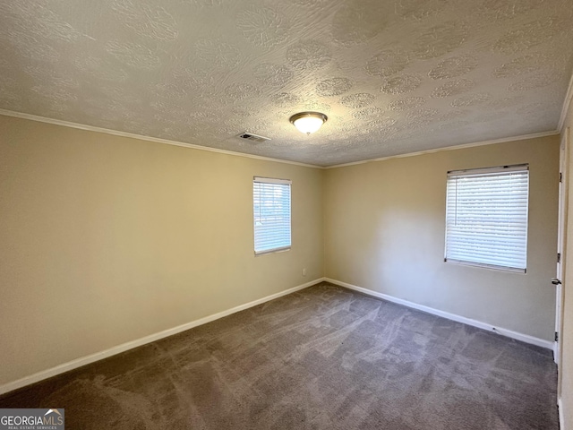 carpeted spare room featuring a textured ceiling and ornamental molding