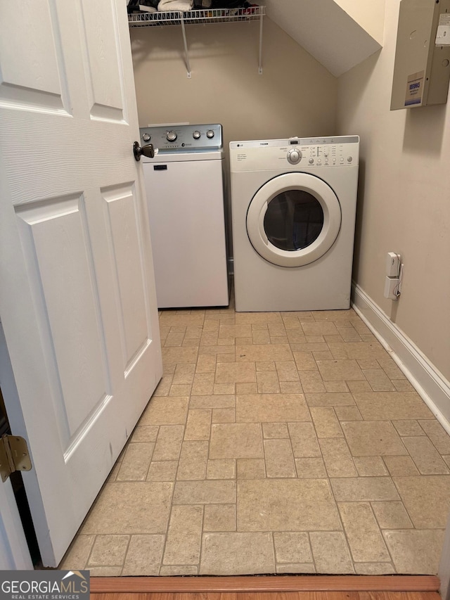 washroom featuring washer and dryer and electric panel