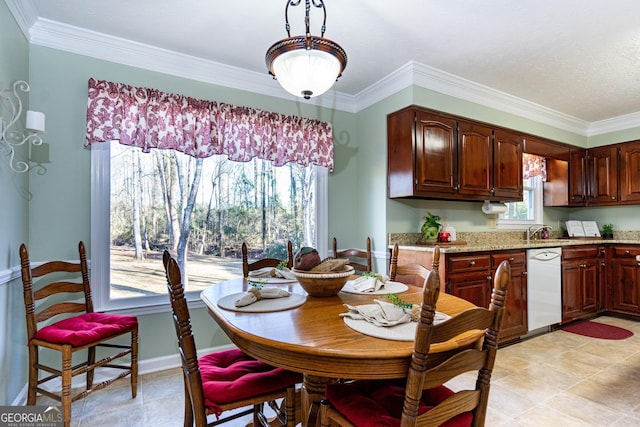 dining area with sink and ornamental molding