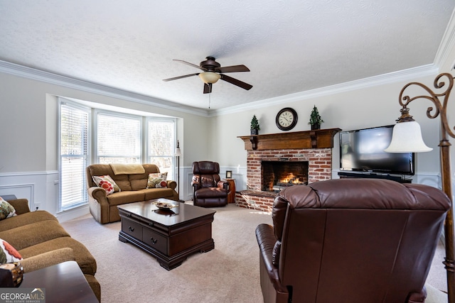 carpeted living room featuring crown molding, ceiling fan, and a textured ceiling