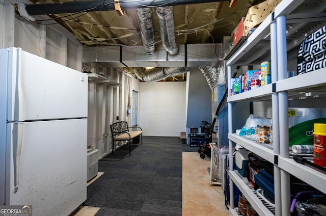 basement with white fridge