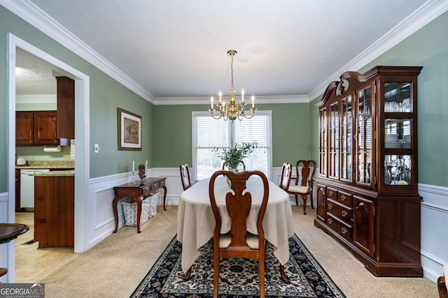 carpeted dining area featuring ornamental molding and a notable chandelier