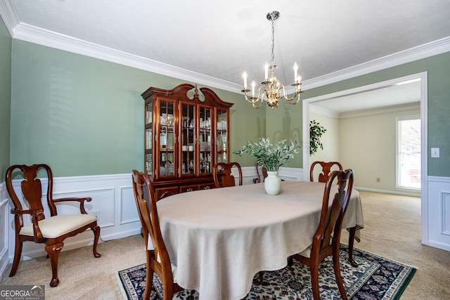 carpeted dining space with crown molding, a textured ceiling, and a chandelier