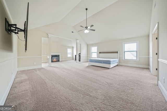 unfurnished bedroom with light carpet and lofted ceiling