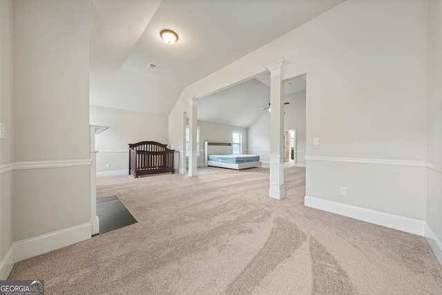 unfurnished living room featuring ceiling fan, carpet flooring, and lofted ceiling