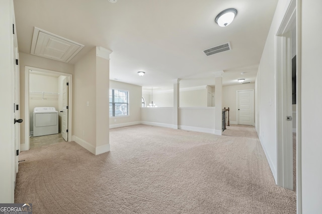 basement featuring washer / dryer and light colored carpet