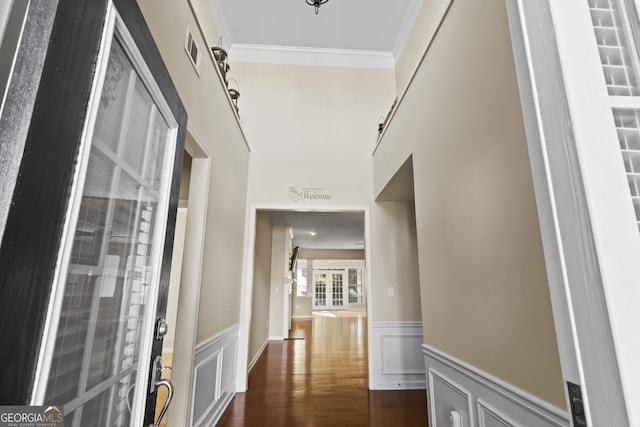 corridor featuring crown molding and dark hardwood / wood-style floors