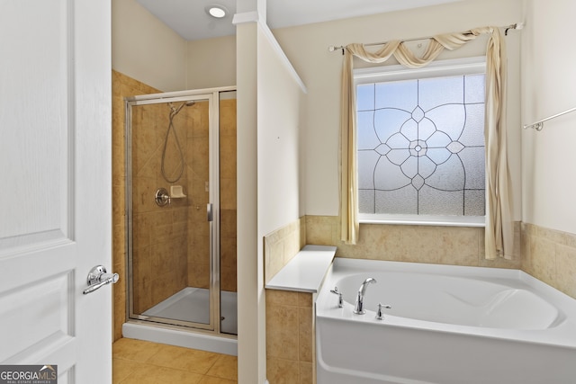 bathroom featuring plus walk in shower and tile patterned flooring