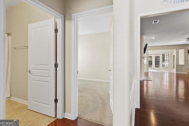 hall with light hardwood / wood-style floors