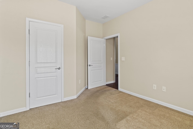 unfurnished bedroom featuring carpet