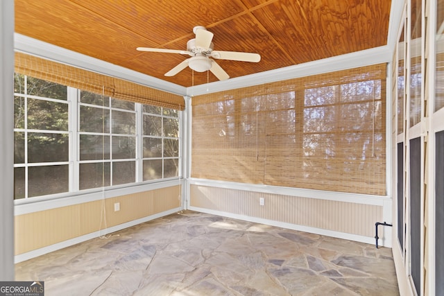 unfurnished sunroom with ceiling fan and wood ceiling