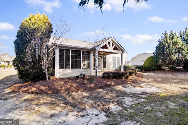 view of front of property with a sunroom