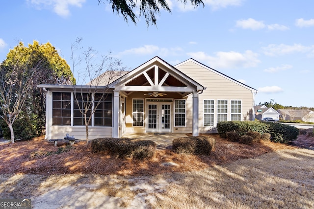 back of property featuring ceiling fan, a sunroom, french doors, and a patio