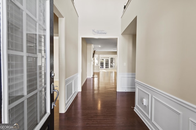 corridor featuring dark wood-type flooring