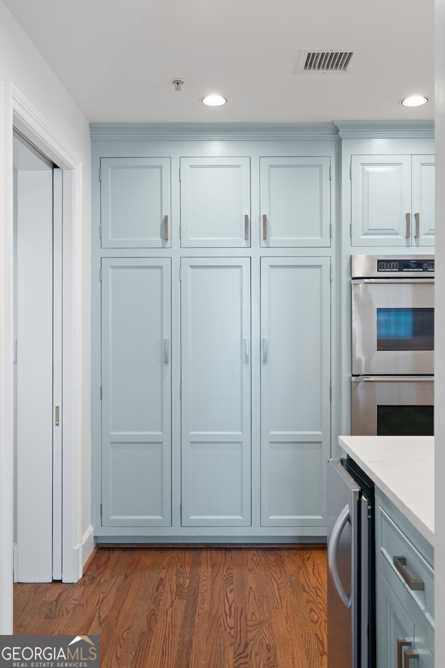 closet with beverage cooler and visible vents