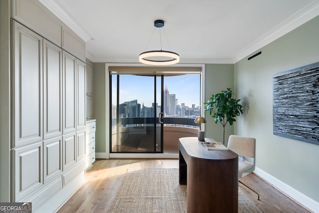 dining area with ornamental molding, light wood-type flooring, a city view, and baseboards