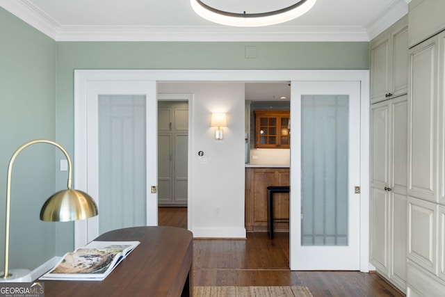 office space featuring dark wood-style floors, baseboards, and crown molding