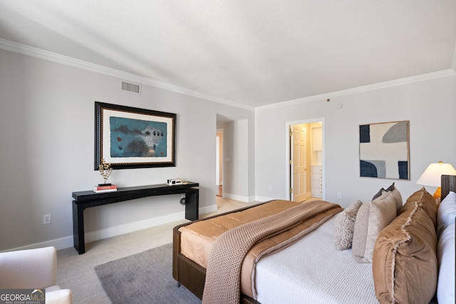 carpeted bedroom featuring visible vents, crown molding, and baseboards