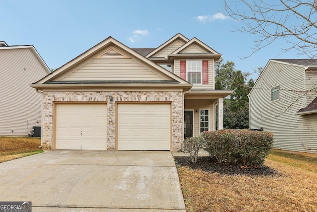 view of front of home featuring a garage and central AC