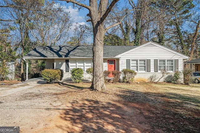 single story home with a carport