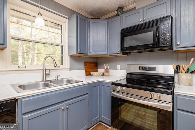 kitchen with a textured ceiling, black appliances, decorative light fixtures, sink, and crown molding