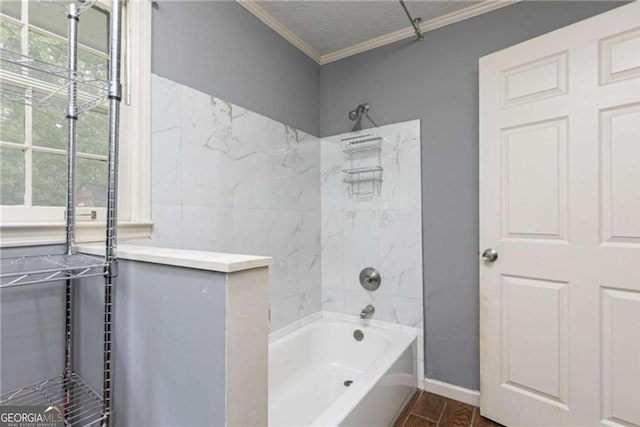 bathroom with shower / tub combination, ornamental molding, and a textured ceiling