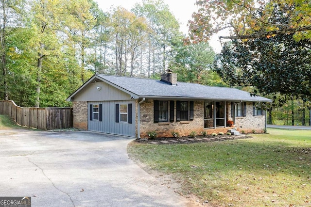 ranch-style home featuring a front yard