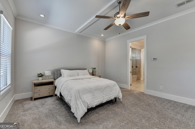 bedroom with multiple windows, ensuite bath, ceiling fan, and carpet flooring