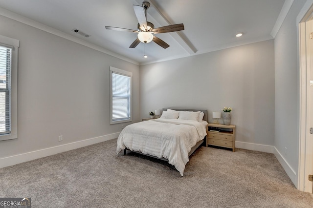 carpeted bedroom with ornamental molding and ceiling fan