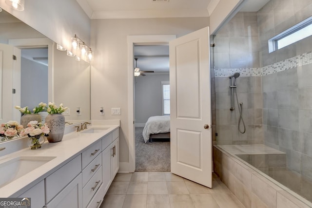 bathroom featuring ornamental molding, a tile shower, vanity, and tile patterned floors