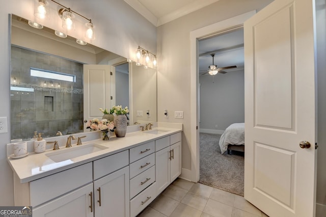 bathroom with tile patterned flooring, vanity, tiled shower, ceiling fan, and crown molding