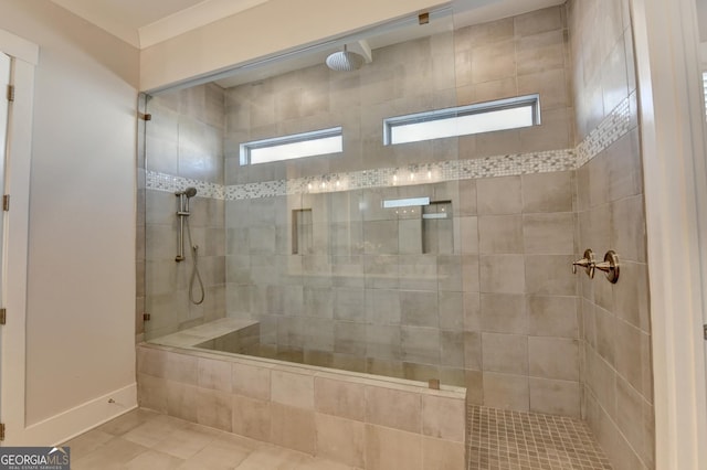 bathroom featuring a tile shower