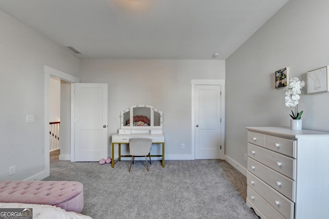 bedroom featuring light carpet