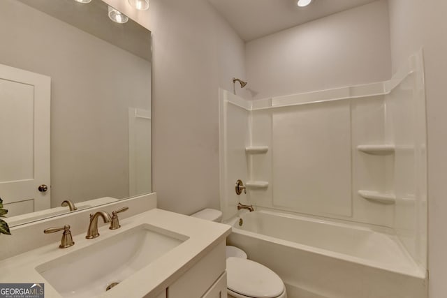 full bathroom featuring vanity, bathtub / shower combination, and toilet