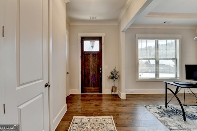 entrance foyer featuring crown molding and dark wood-type flooring