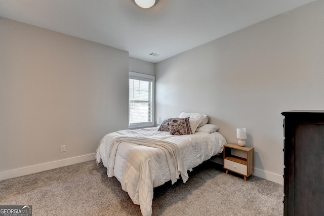 bedroom with light carpet