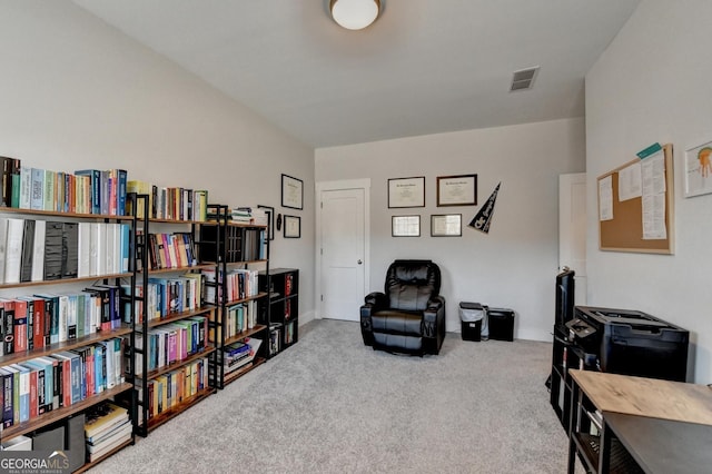 living area featuring carpet flooring