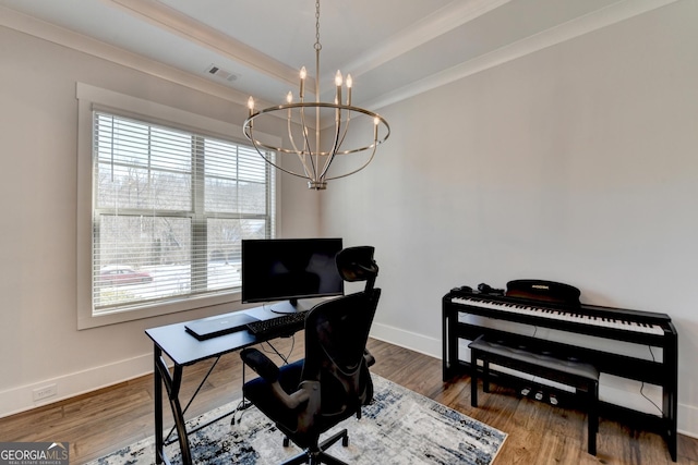 office space with wood-type flooring, ornamental molding, and a chandelier