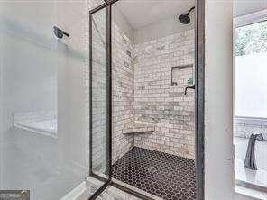 bathroom with an enclosed shower