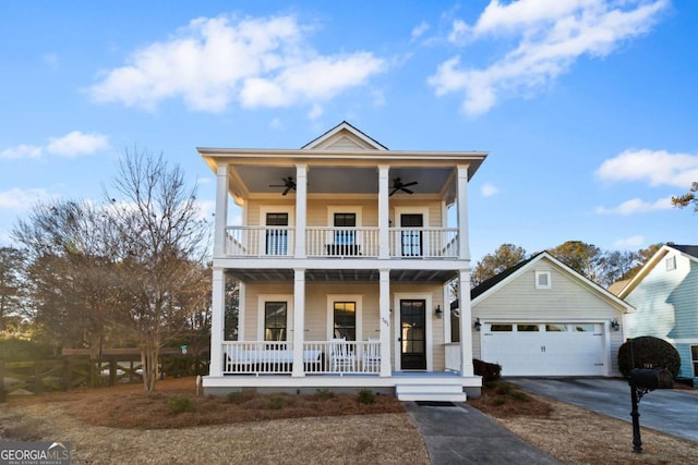 view of front of property featuring a balcony, a porch, a garage, and ceiling fan