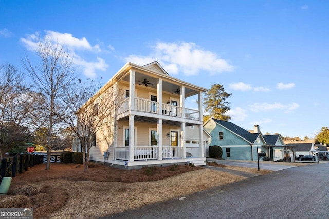 view of front of property featuring a balcony, a porch, and ceiling fan