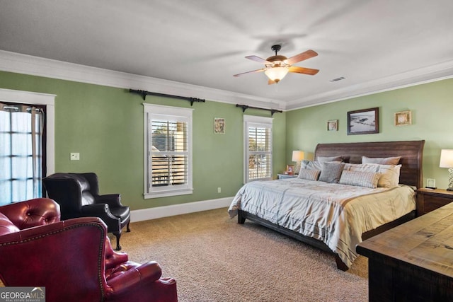 bedroom featuring ceiling fan, carpet floors, and ornamental molding