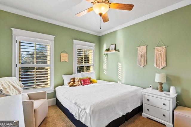 bedroom featuring carpet, ceiling fan, and ornamental molding