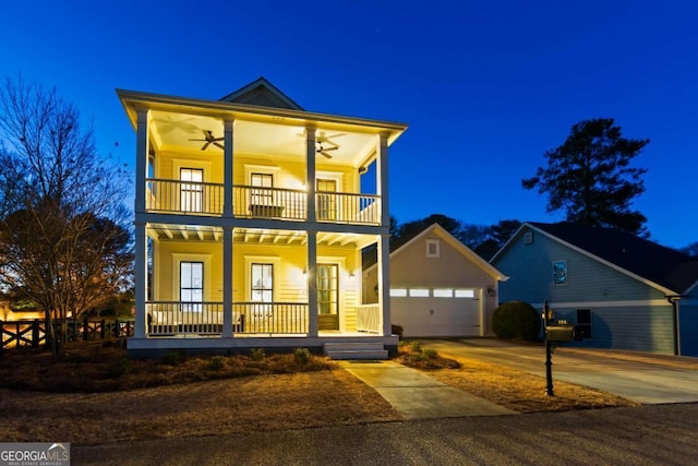 view of front of home featuring a balcony, a garage, ceiling fan, and a porch