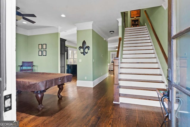 playroom featuring ceiling fan, billiards, ornamental molding, and dark wood-type flooring